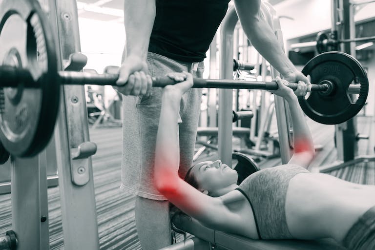 You should ensure complete recovery before resuming weightlifting to avoid the risk of more serious injuries.